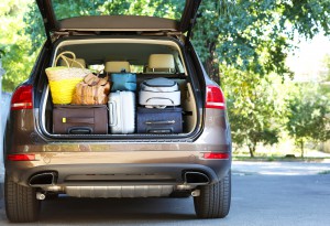 Suitcases and bags in trunk of car ready to depart for holidays