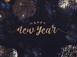 Happy New Year Celebration Text with Festive Gold Fireworks Collage in Night Sky