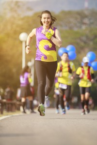 Woman asian Marathon running race, Run up the mountain road.