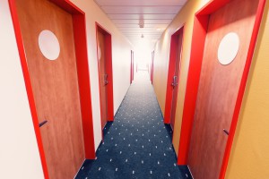 Empty Hotel corridor with row of doors